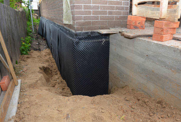 SJ Waterproofing Pros technician performing targeted Waterproofing assessment in Bay Shore, NY
